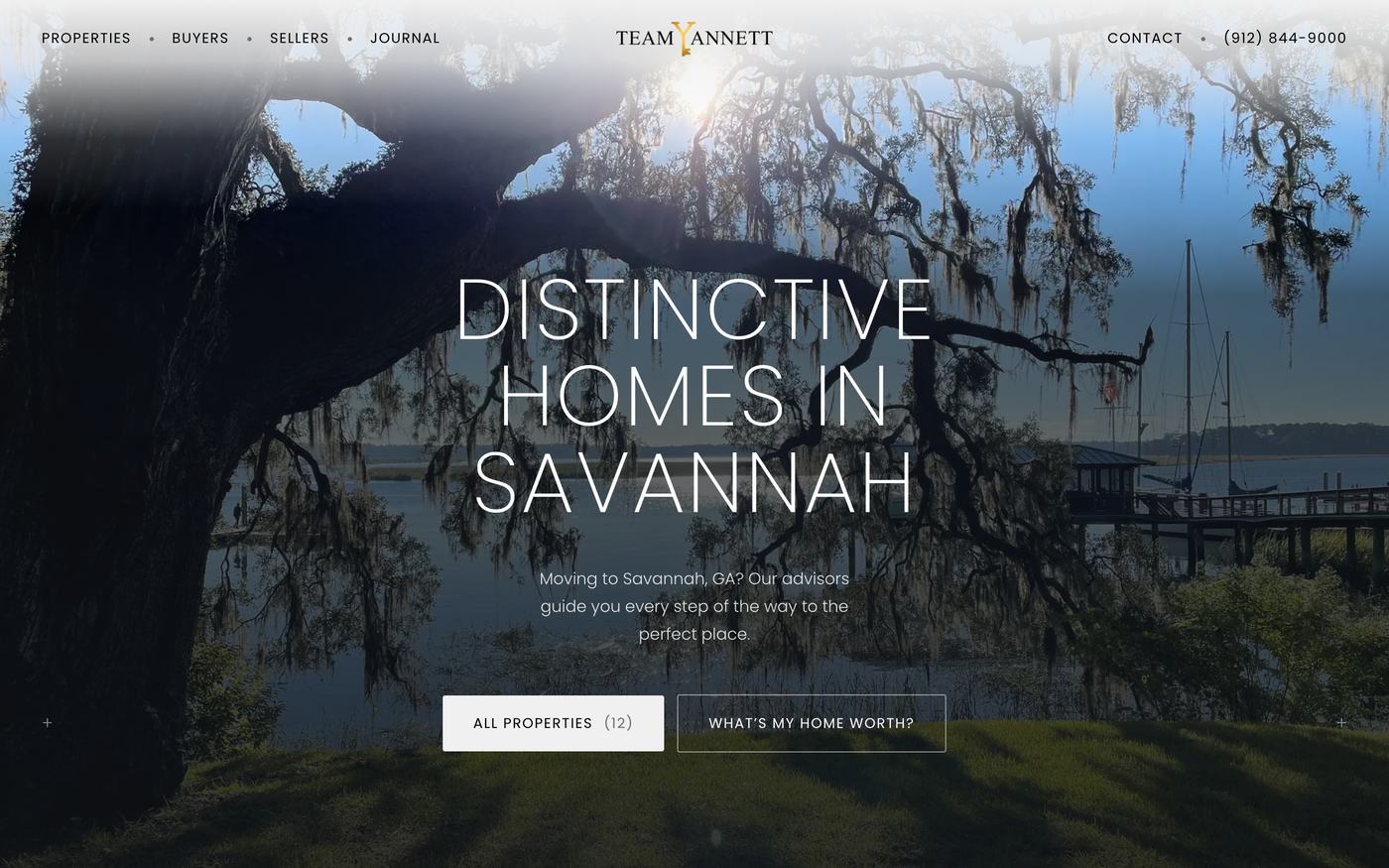 The Team Yannett home page: wide-tracked type reading Distinctive Homes In Savannah over a photograph of live oaks, with buttons for all properties and a home valuation.